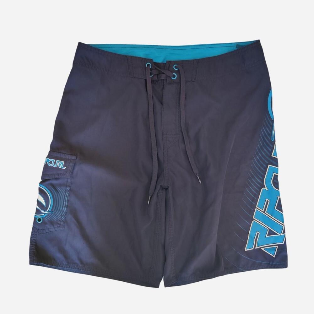 Rip Curl navy blue board shorts with blue wave graphic and 'RIP CURL' text
